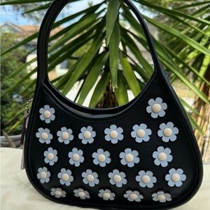 Coach Ergo Bag In Mini Flower Applique
Upcrafted Leather